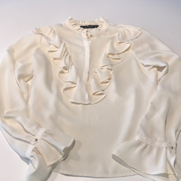 cream frilly blouse